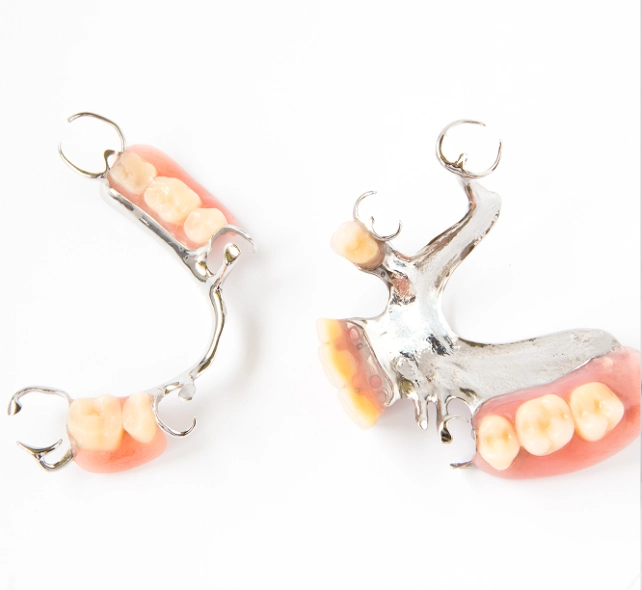 A close-up of a pair of dentures with realistic teeth attached, showcasing dental craftsmanship and design.